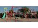 Modern community playground with swings, slides, and climbing areas set next to Gathering homes at 336 Carolina Springs Blvd, Apex, NC 27539