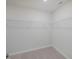 Empty closet with wire shelving at 373 Thompson Overlook Way # 233, Smithfield, NC 27577
