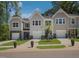 Townhomes featuring a mix of siding, stone accents, and well-kept landscaping at 373 Thompson Overlook Way # 233, Smithfield, NC 27577