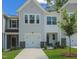 Inviting townhome with an attached garage and well manicured lawn at 373 Thompson Overlook Way # 233, Smithfield, NC 27577