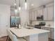 Modern kitchen with stainless steel appliances, white cabinets and spacious island at 373 Thompson Overlook Way # 233, Smithfield, NC 27577