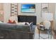 Cozy living room with modern furnishings and a beach view displayed on TV at 373 Thompson Overlook Way # 233, Smithfield, NC 27577