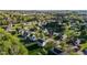 Aerial view of a neighborhood with lush greenery, landscaping, and mature trees at 3809 Long Meadow Dr, Mebane, NC 27302