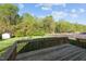 Wood deck overlooks a spacious back yard, fenced perimeter, and shed at 3809 Long Meadow Dr, Mebane, NC 27302