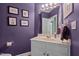 Elegant half bathroom features a vanity sink and charming decor at 3809 Long Meadow Dr, Mebane, NC 27302