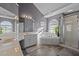 Bright bathroom featuring a bathtub, shower, vanity, and tile floors at 3809 Long Meadow Dr, Mebane, NC 27302