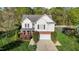 Charming two-story home with a well-manicured lawn and an attached two-car garage, offering curb appeal at 3809 Long Meadow Dr, Mebane, NC 27302