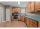 Functional kitchen featuring oak cabinets, modern appliances, and durable countertops for cooking at 3809 Long Meadow Dr, Mebane, NC 27302