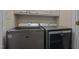 This laundry room features modern side by side washer and dryer units at 3809 Long Meadow Dr, Mebane, NC 27302