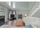 Comfortable living room features high ceilings, fireplace, and wood floors at 3809 Long Meadow Dr, Mebane, NC 27302