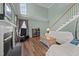 Inviting living room with vaulted ceilings, cozy fireplace, and staircase, providing a relaxing atmosphere at 3809 Long Meadow Dr, Mebane, NC 27302
