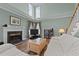 Inviting living room features a fireplace, wood floors, and lots of natural light at 3809 Long Meadow Dr, Mebane, NC 27302