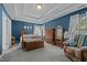 Spacious bedroom features a tray ceiling, windows, and neutral carpet at 3809 Long Meadow Dr, Mebane, NC 27302