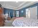 Comfortable bedroom featuring a tray ceiling and access to the bathroom at 3809 Long Meadow Dr, Mebane, NC 27302