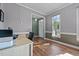 Home office with ample natural light, neutral walls, and hardwood flooring for a productive workspace at 3809 Long Meadow Dr, Mebane, NC 27302