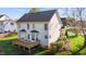 Two-story home features a wood deck and backyard at 3809 Long Meadow Dr, Mebane, NC 27302
