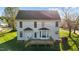 Back of home with large windows overlooks a spacious deck and yard at 3809 Long Meadow Dr, Mebane, NC 27302