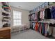 Spacious walk-in closet features shelving and rods for organized storage at 3809 Long Meadow Dr, Mebane, NC 27302