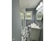 Modern bathroom with a glass shower, vanity, and marble tile flooring at 3815 Weyburn Rd, Durham, NC 27704