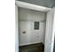 Utility closet featuring laminate wood flooring with electrical components and shelving at 3815 Weyburn Rd, Durham, NC 27704