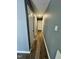 Hallway featuring new floors and neutral paint, connecting various rooms in the home at 3815 Weyburn Rd, Durham, NC 27704