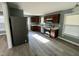 Updated kitchen with stainless steel appliances, dark wood cabinets and new floors at 3815 Weyburn Rd, Durham, NC 27704