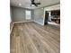 Inviting living room featuring new floors, neutral paint, and a ceiling fan at 3815 Weyburn Rd, Durham, NC 27704