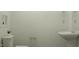 Bathroom featuring pedestal sink and a toilet with a decorative plant on top at 385 Thompson Overlook Way # 236, Smithfield, NC 27577