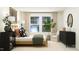 Comfortable bedroom with a sitting area, complemented by bright natural light and tasteful decor at 385 Thompson Overlook Way # 236, Smithfield, NC 27577