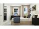 Cozy bedroom featuring a baseball score board, complemented by stylish bedside decor and soft natural light at 385 Thompson Overlook Way # 236, Smithfield, NC 27577