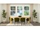 Elegant dining room bathed in natural light, furnished with a wooden table, green chairs, and stylish plants at 385 Thompson Overlook Way # 236, Smithfield, NC 27577