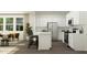 Modern kitchen with white cabinets and stainless steel appliances open to a dining area, great for entertaining at 385 Thompson Overlook Way # 236, Smithfield, NC 27577