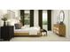 Comfortable bedroom featuring three windows, decorative pillows, and a light-wood dresser at 385 Thompson Overlook Way # 236, Smithfield, NC 27577