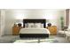 Elegant main bedroom with a plush bed, decorative pillows, and coordinating nightstands at 385 Thompson Overlook Way # 236, Smithfield, NC 27577