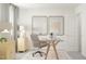 Bright home office with a glass desk, comfortable chair, and stylish decor at 385 Thompson Overlook Way # 236, Smithfield, NC 27577