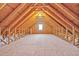 Spacious attic area with exposed wooden beams and natural light at 4 Calwell Creek Dr, Chapel Hill, NC 27517
