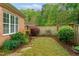 Landscaped backyard with lush plants and grass at 4 Calwell Creek Dr, Chapel Hill, NC 27517