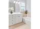Bathroom with double vanity, bathtub, tile floors, and neutral paint at 4 Calwell Creek Dr, Chapel Hill, NC 27517