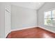 Bright bedroom features hardwood flooring, a ceiling fan and closet at 4 Calwell Creek Dr, Chapel Hill, NC 27517