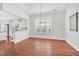 Spacious dining area with hardwood floors and adjacent to modern, well-lit kitchen at 4 Calwell Creek Dr, Chapel Hill, NC 27517