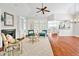 Elegant living room featuring hardwood floors, a fireplace, built-in bookshelves, and stylish furnishings at 4 Calwell Creek Dr, Chapel Hill, NC 27517
