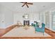 Cozy living room with fireplace, built-in shelves, hardwood floors and stylish furniture at 4 Calwell Creek Dr, Chapel Hill, NC 27517