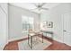 Bright, spacious office with hardwood floors, a ceiling fan, and natural light from a window at 4 Calwell Creek Dr, Chapel Hill, NC 27517
