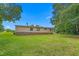 A backyard features a well-manicured lawn with a house in the background at 4047 Mistletoe Dr, Burlington, NC 27217
