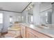 Bright bathroom with double sinks, a large mirror, and a tub with steps at 4047 Mistletoe Dr, Burlington, NC 27217