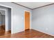 Bedroom with wood-look flooring and basic decor, ready for personalization at 4047 Mistletoe Dr, Burlington, NC 27217