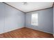 Simple bedroom with wood-look flooring and natural light from window at 4047 Mistletoe Dr, Burlington, NC 27217