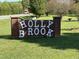 Holly Brook community entrance sign with brick surround and white lettering at 4047 Mistletoe Dr, Burlington, NC 27217