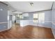 Open dining area with wood-look floors, neutral paint, and plenty of natural light at 4047 Mistletoe Dr, Burlington, NC 27217