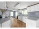 Functional kitchen with white cabinets, neutral countertops, and ample storage space at 4047 Mistletoe Dr, Burlington, NC 27217